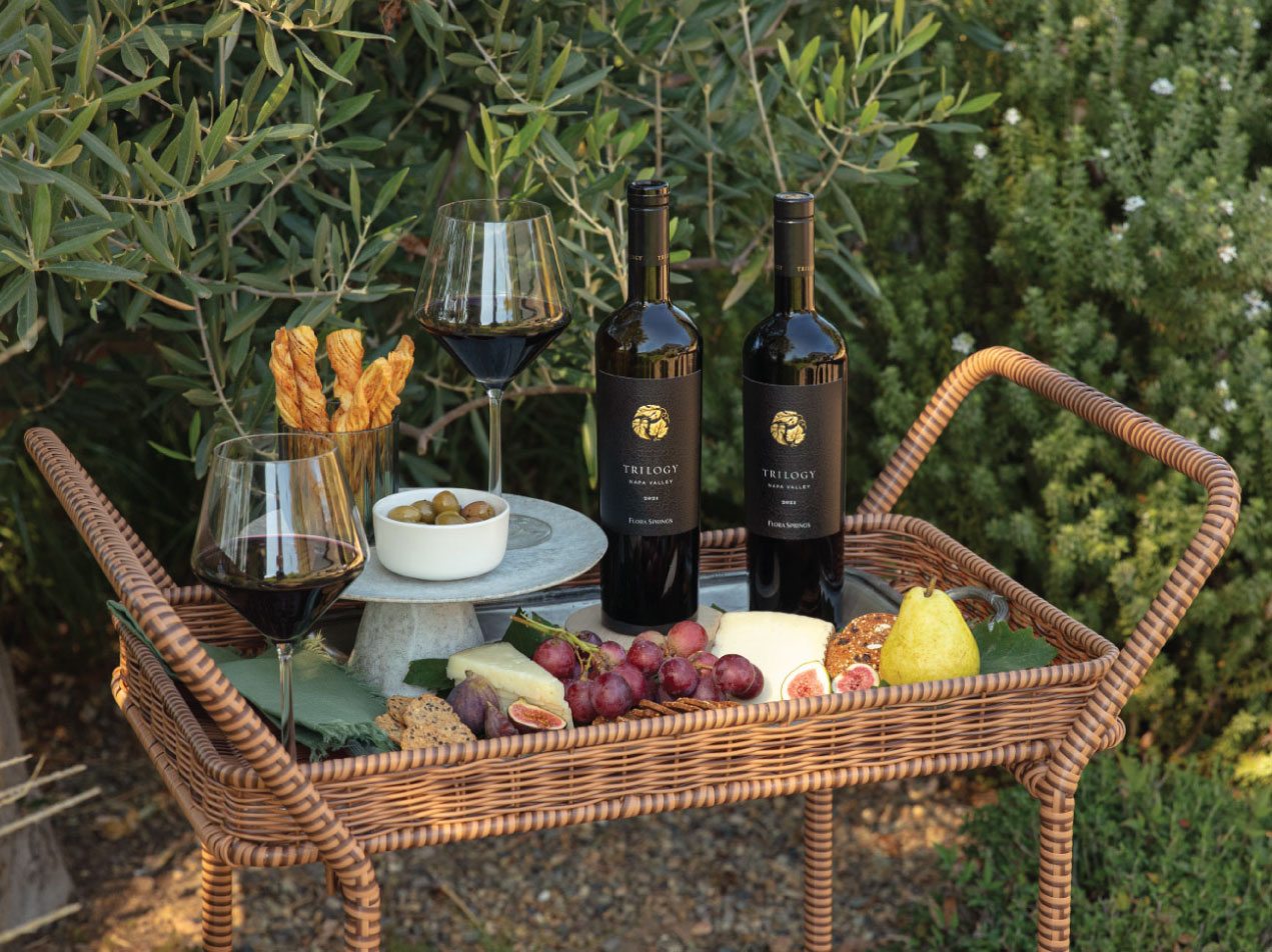 Flora Springs Trilogy Wines on a Cart with Food.