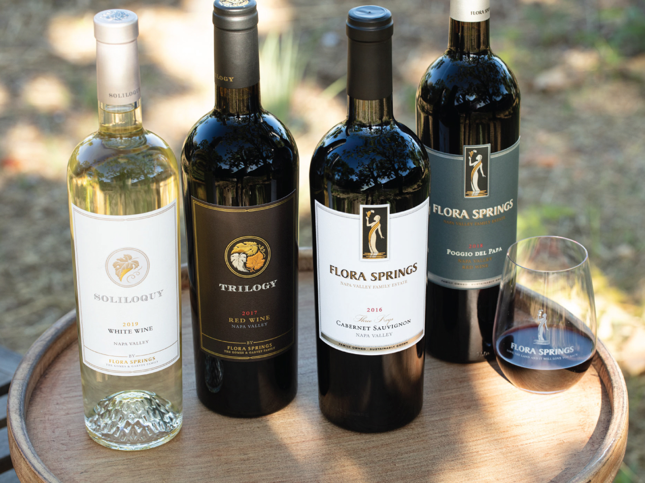 Flora Springs Red and White Wines on a Wooden Tray.