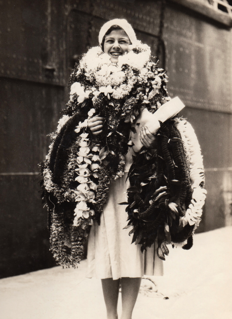 Flora Komes Adorned with Flowers.