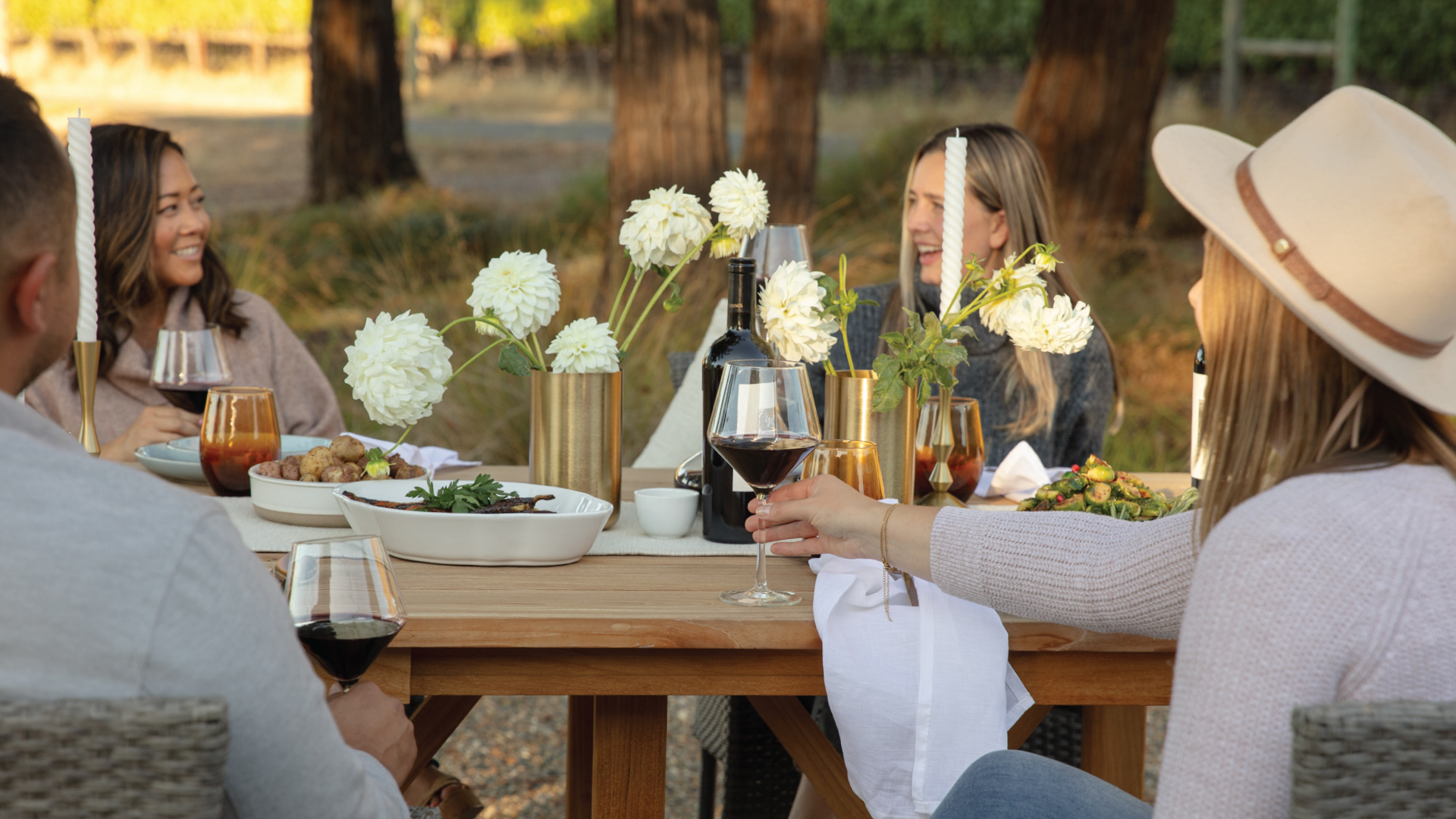 People enjoying Flora Springs wines outdoors.