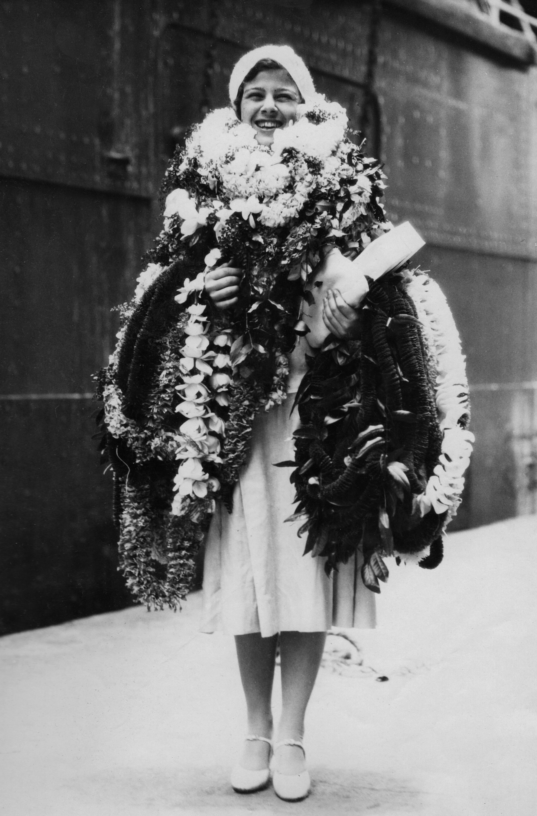 Flora Komes with flowers.